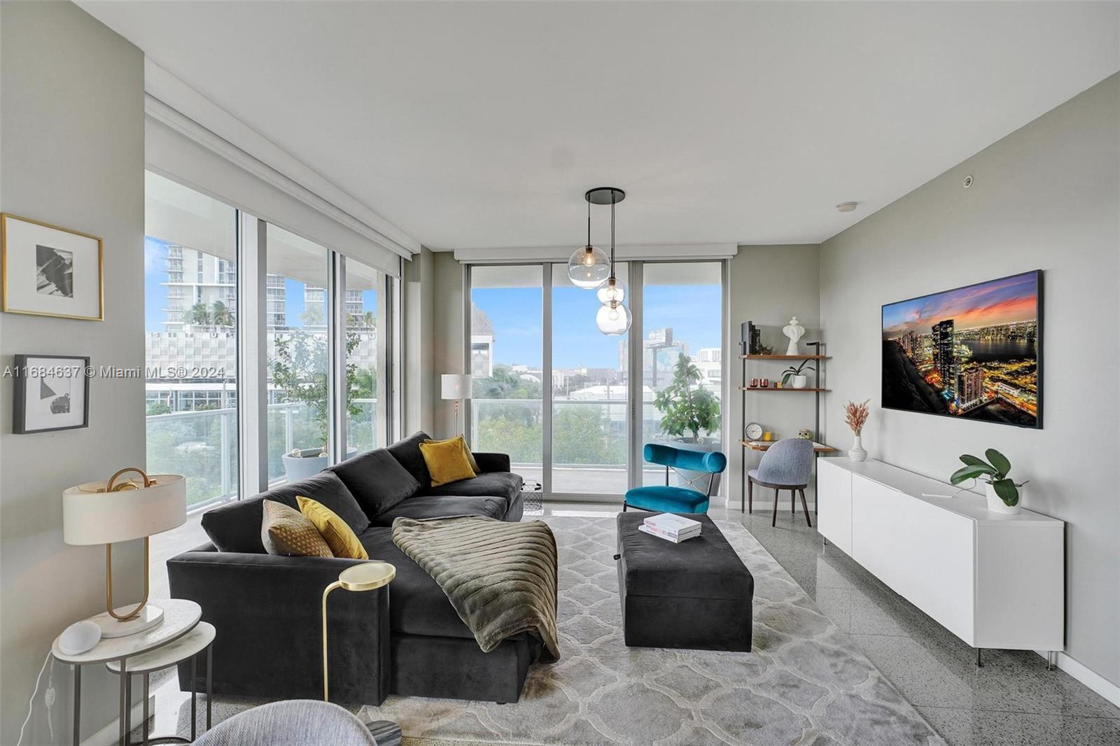 a living room with furniture and a flat screen tv