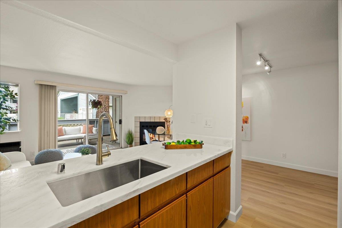 a kitchen that has a sink and a stove in it