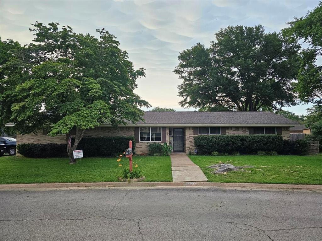 a front view of a house with yard