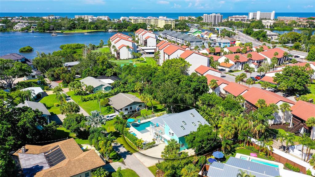 an aerial view of a houses with a lake view