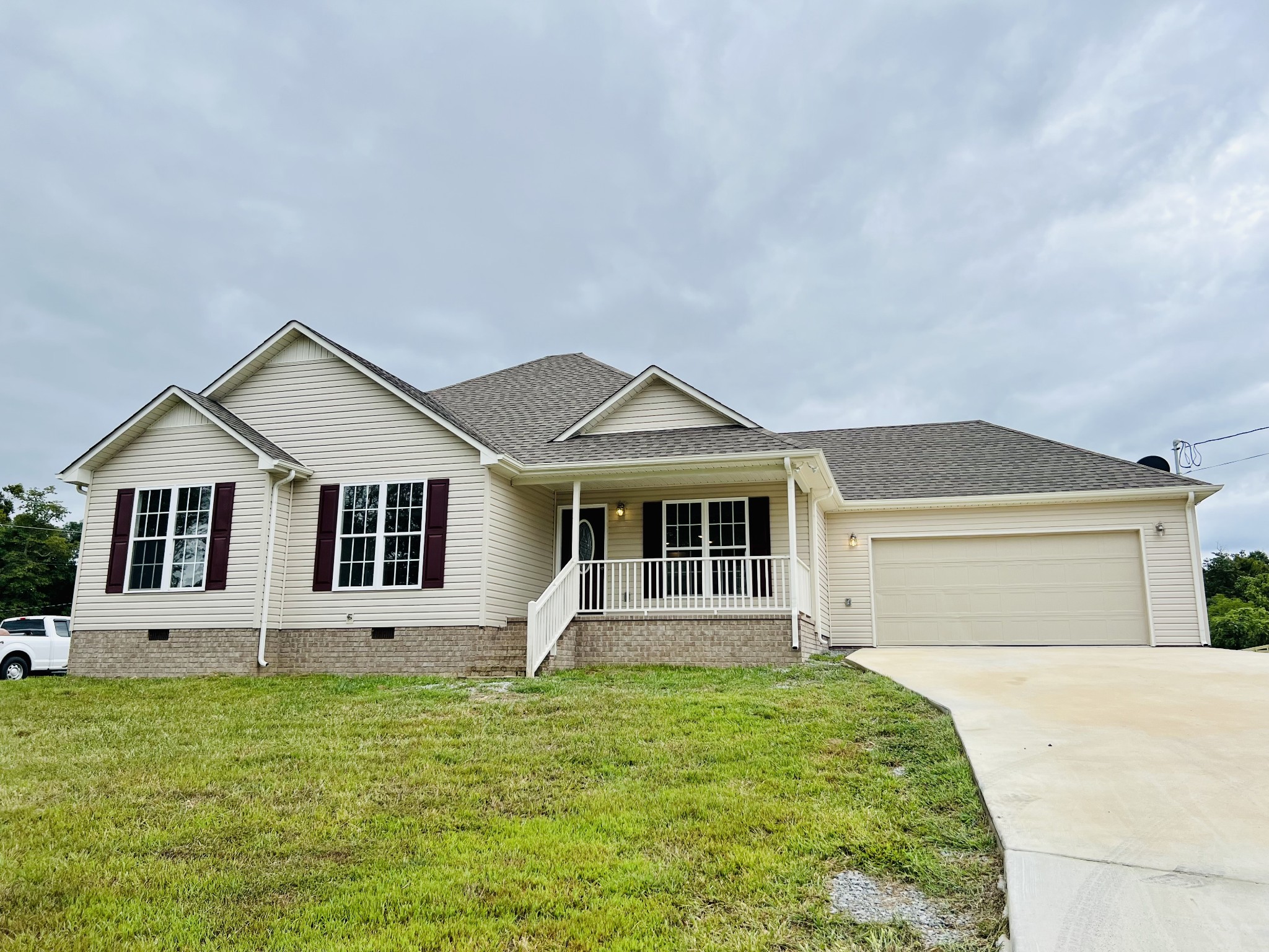 front view of a house with a yard