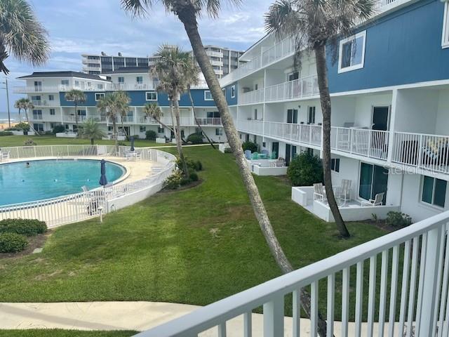 a view of swimming pool from a balcony