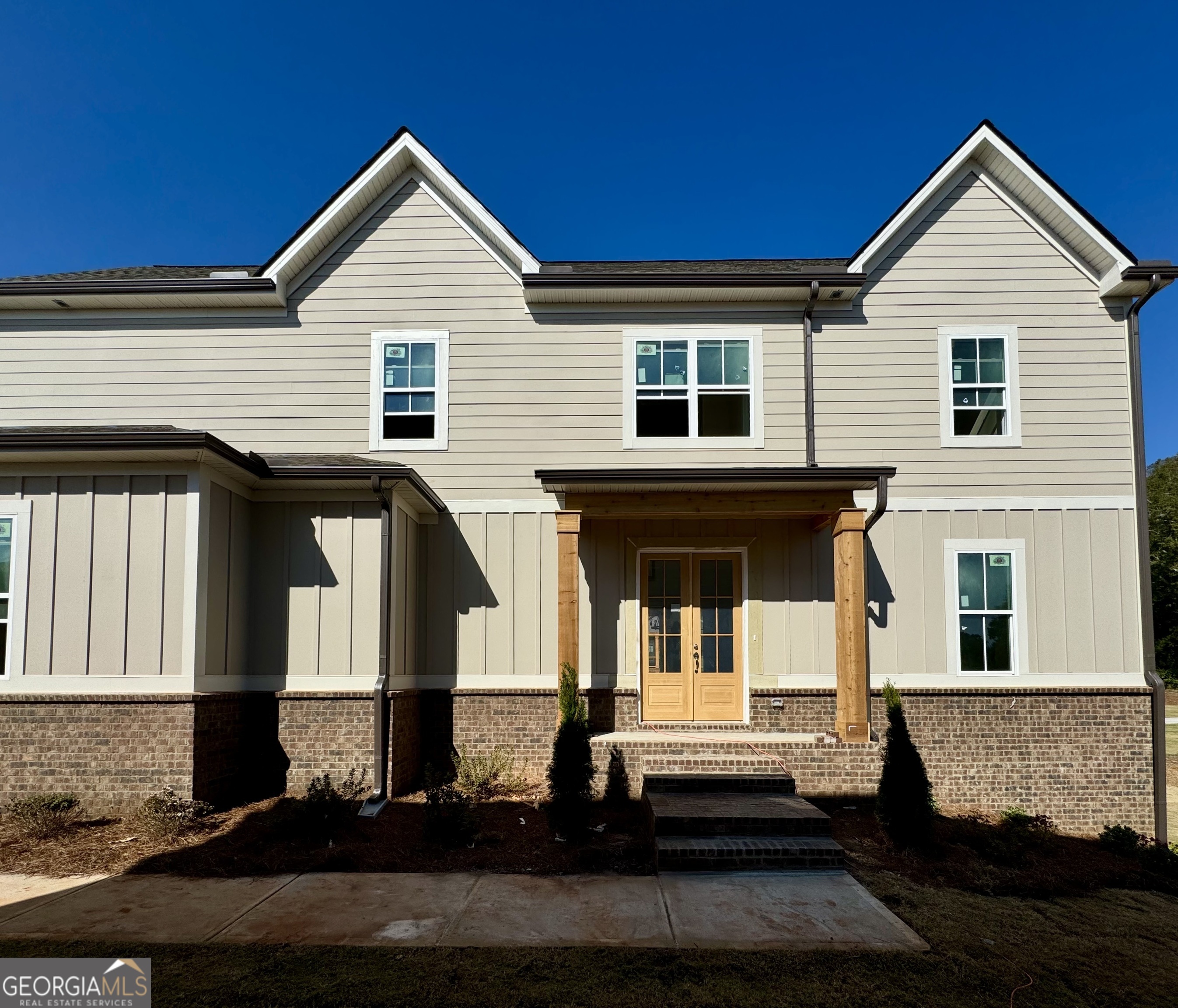 a front view of a house with stairs