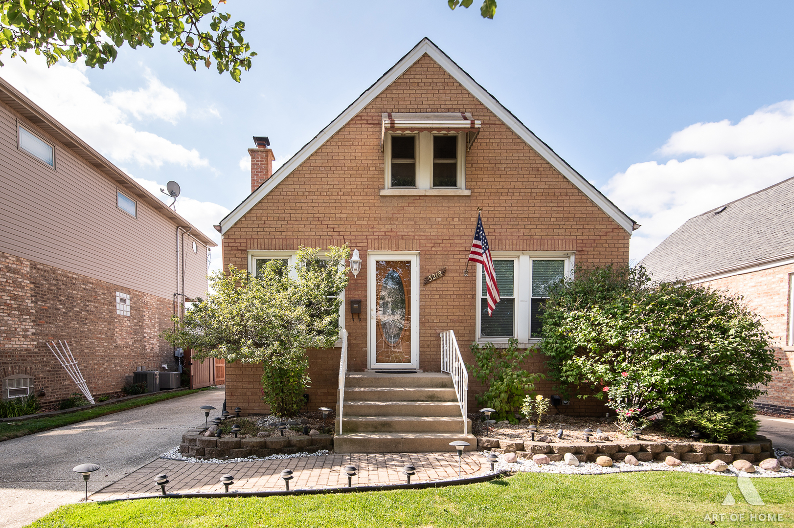 a front view of a house with garden