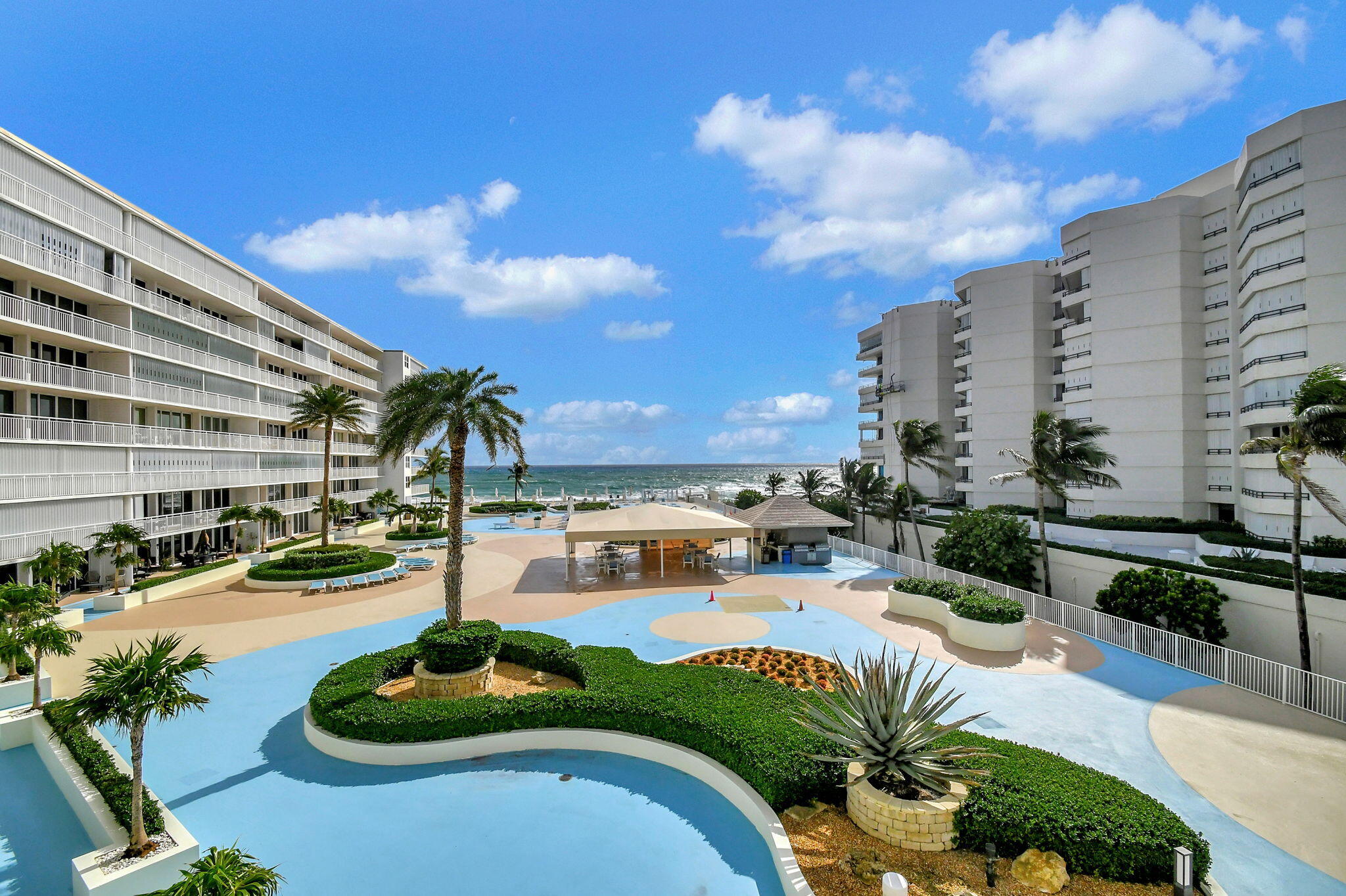 a view of a swimming pool with a patio