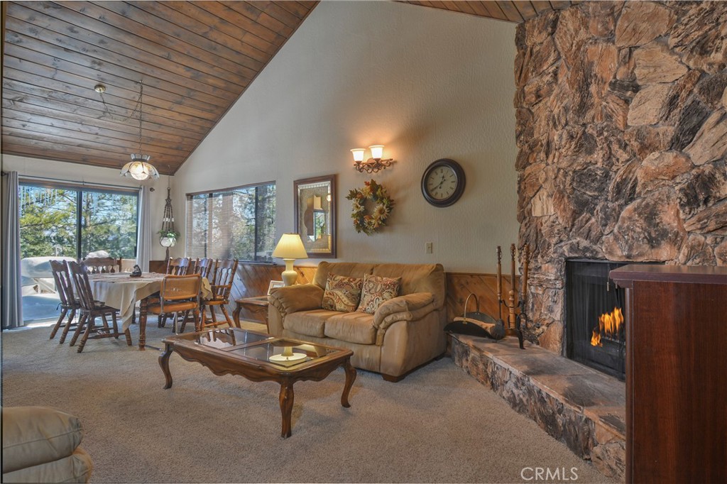 a living room with furniture and a clock