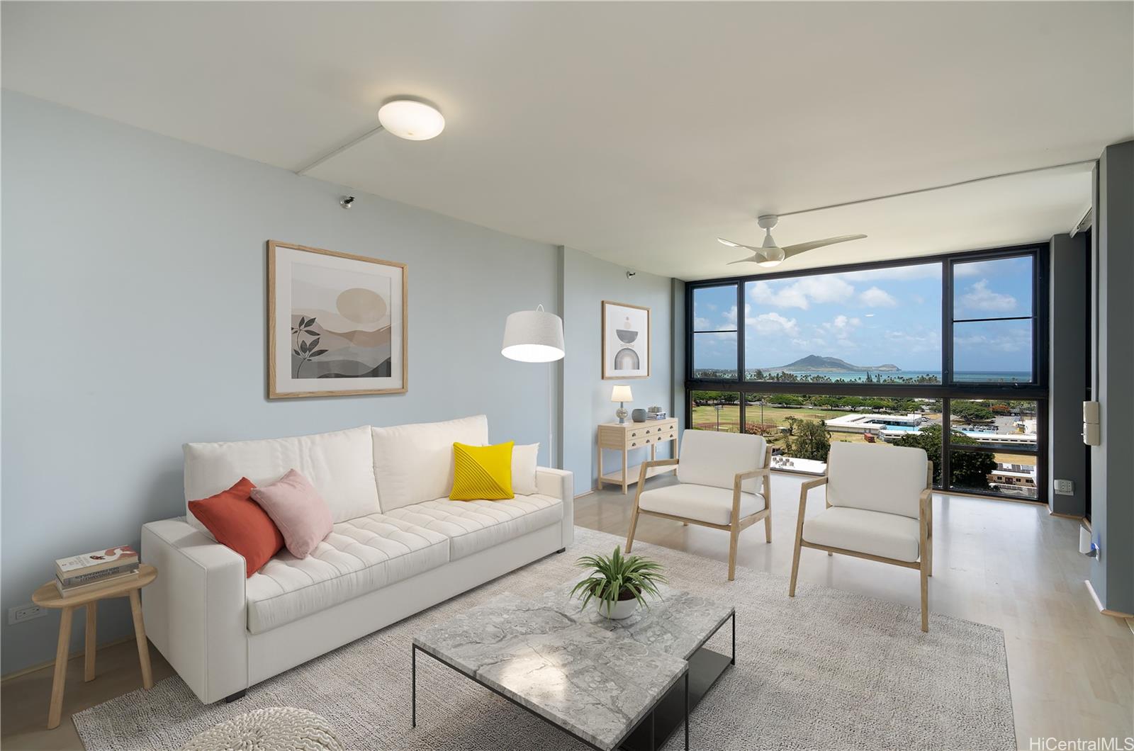 a living room with furniture and a large window