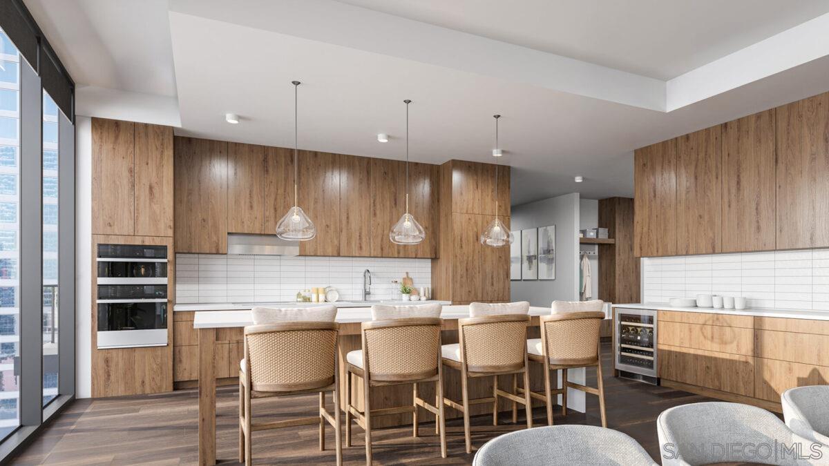 a kitchen with kitchen island granite countertop a white cabinets and chairs