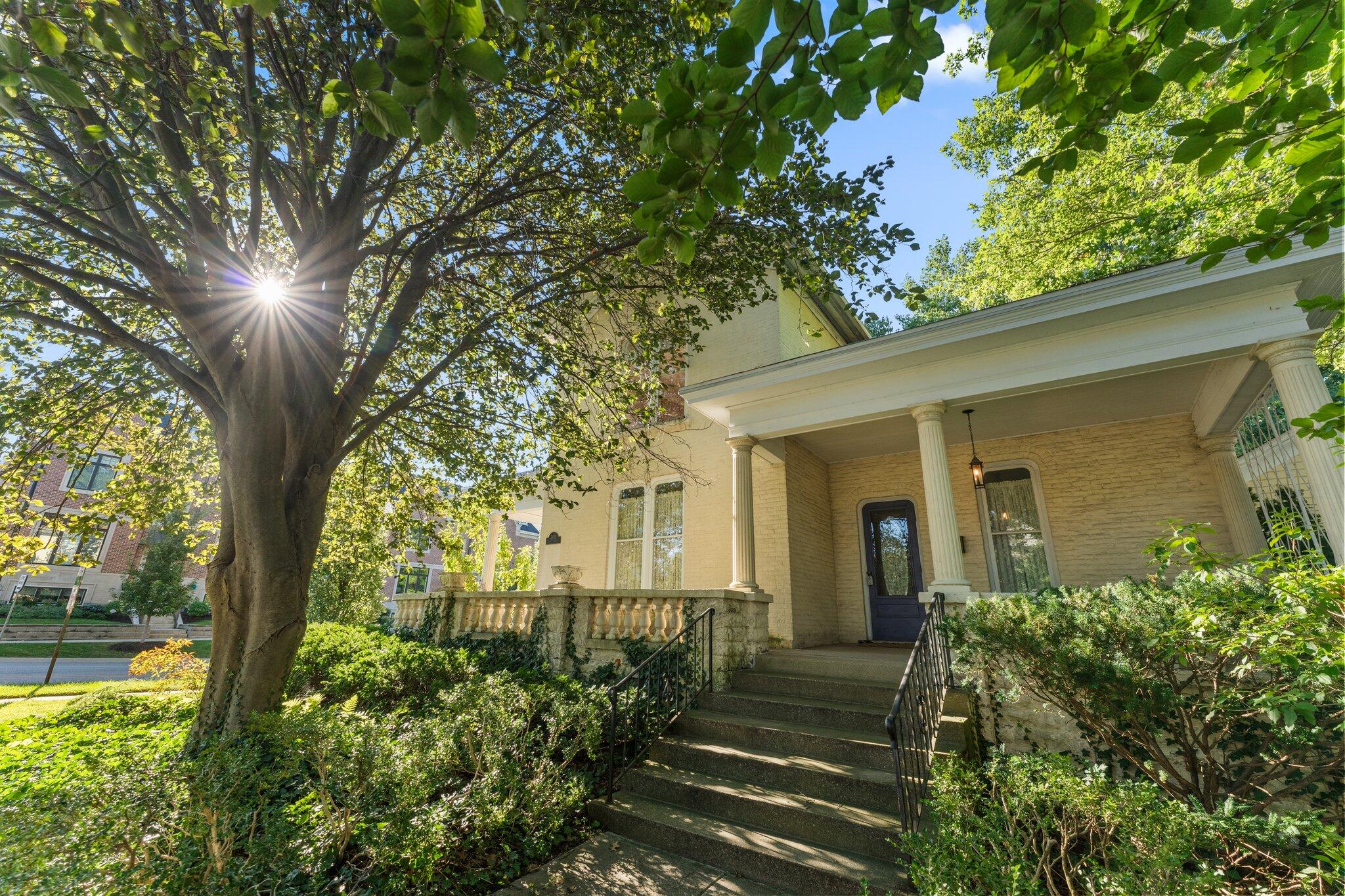 a front view of a house with garden