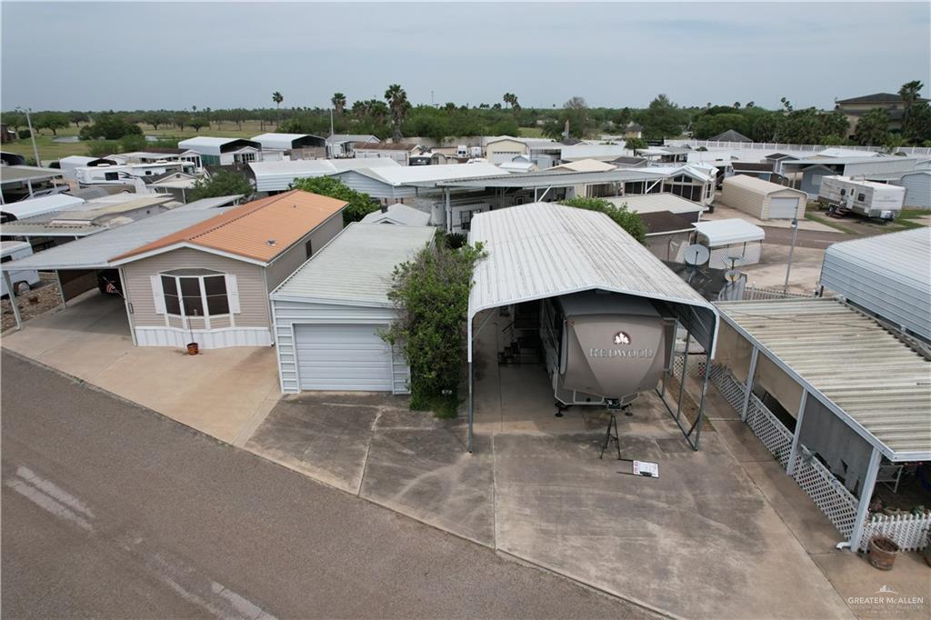 an aerial view of a house with outdoor space