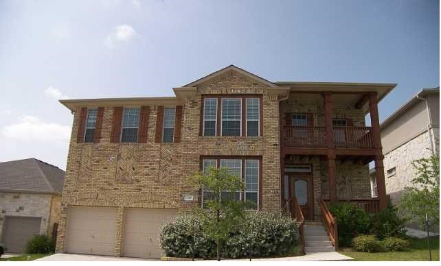 a front view of a house with yard