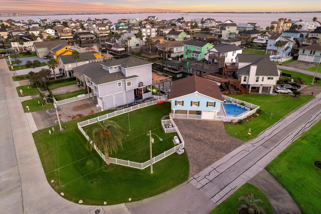 an aerial view of a house with a swimming pool