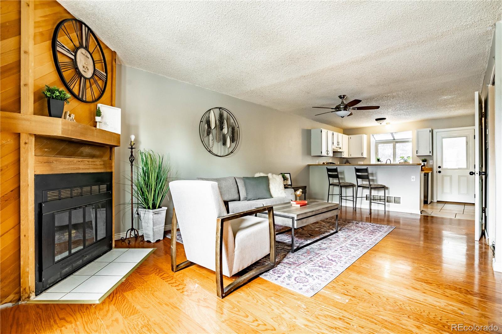 a living room with furniture and a fireplace