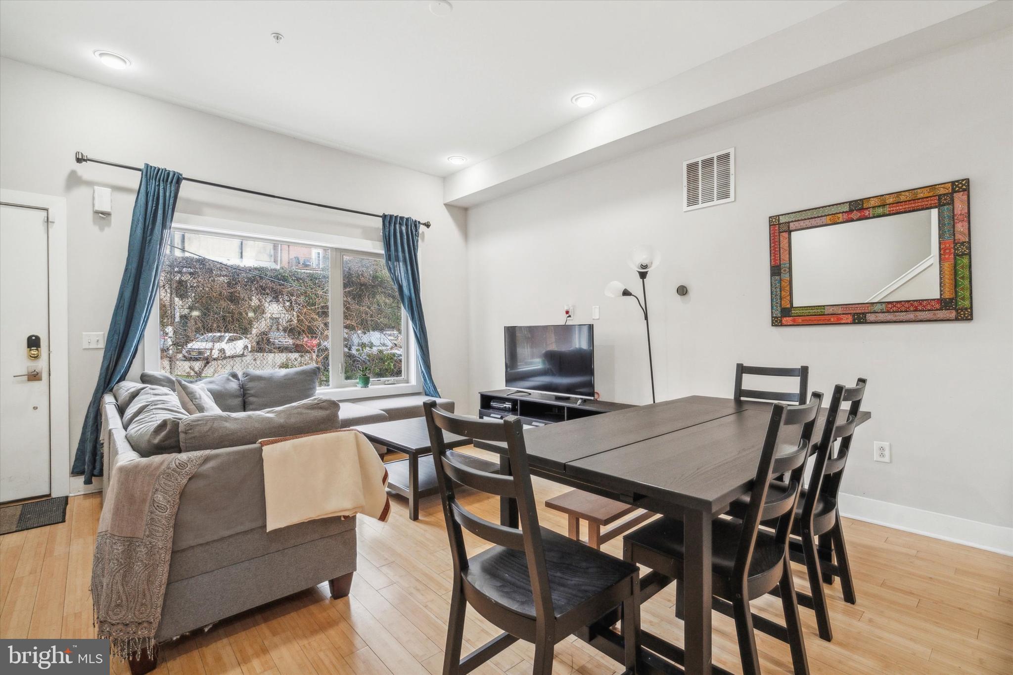 a view of a dining room with furniture large window and outside view