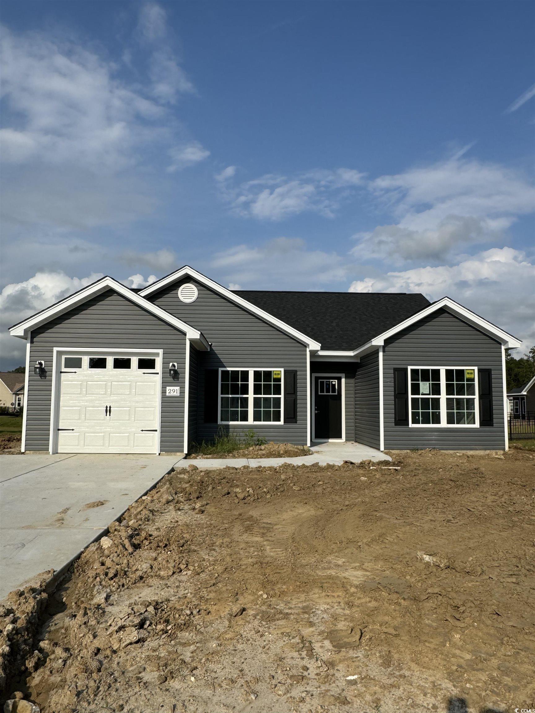 Ranch-style home featuring a garage