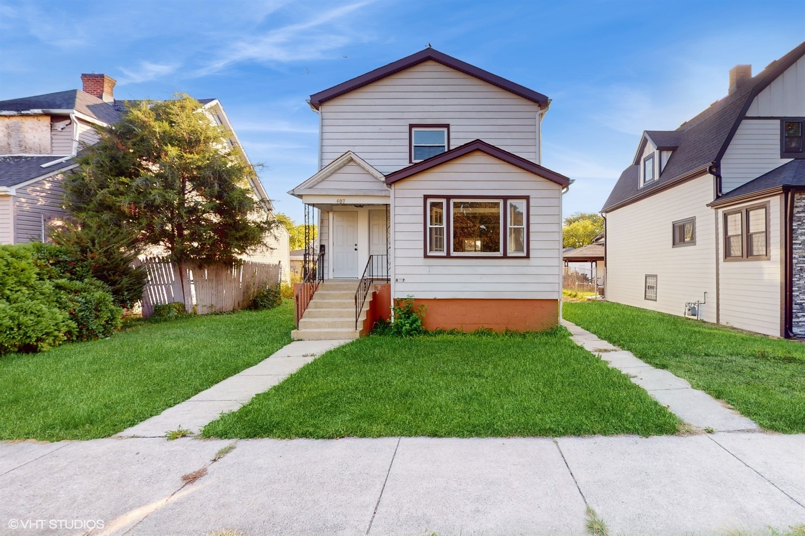 a front view of a house with a yard