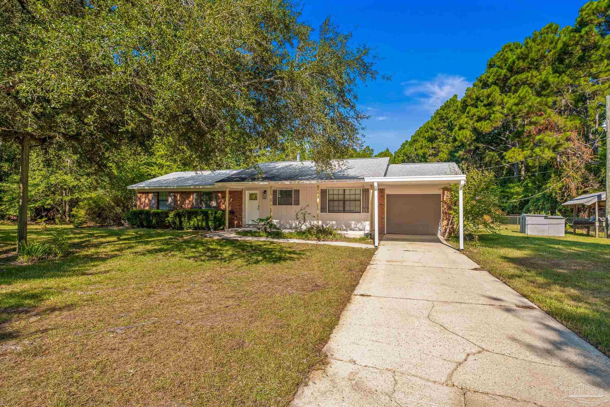 a front view of a house with yard porch and furniture