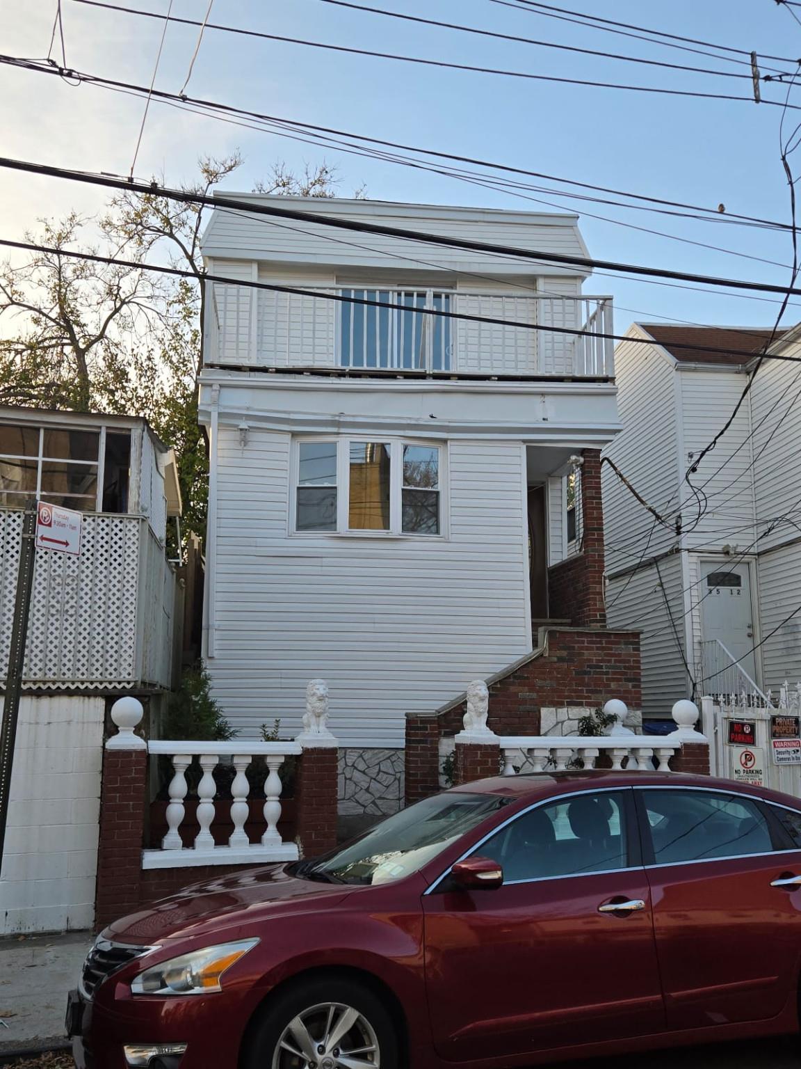 a car parked in front of a house