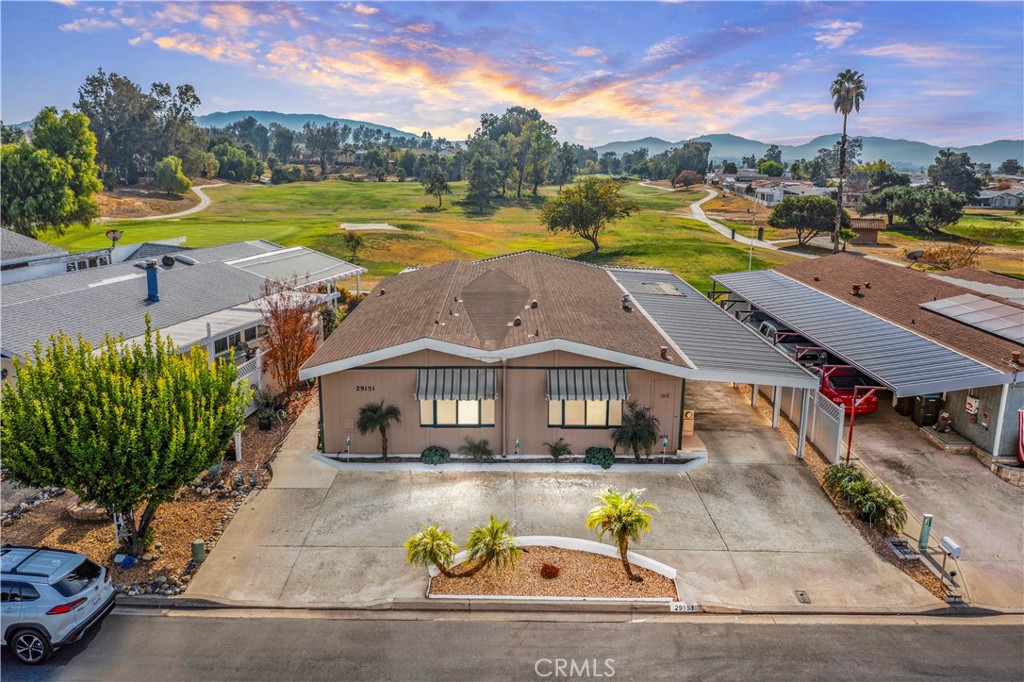 an aerial view of a house with a swimming pool