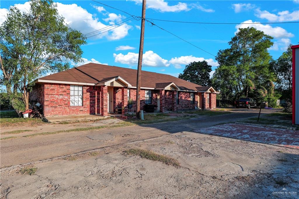 a house with yard in front of it