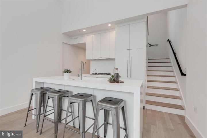 a kitchen with a table and chairs