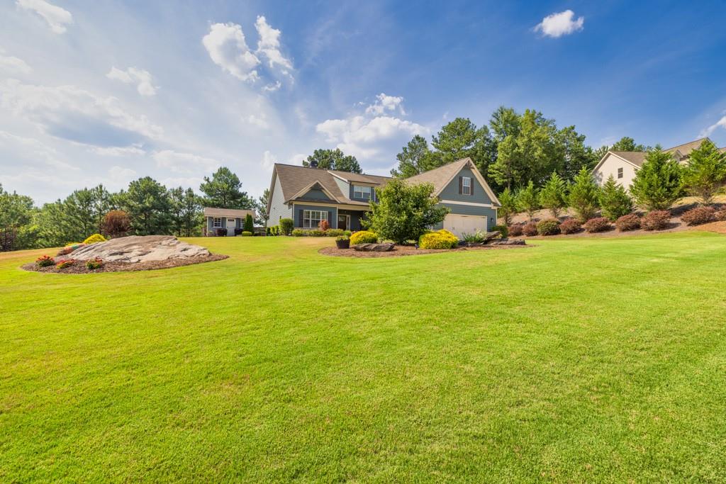 a view of a house with a big yard