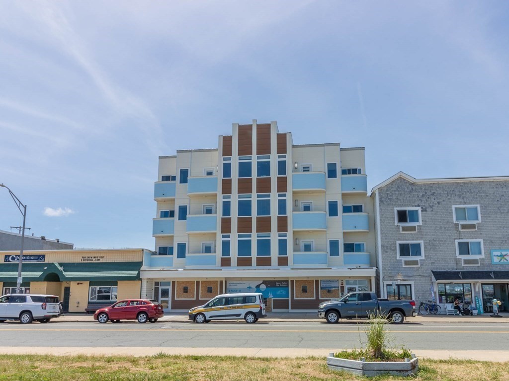 a front view of building with street view