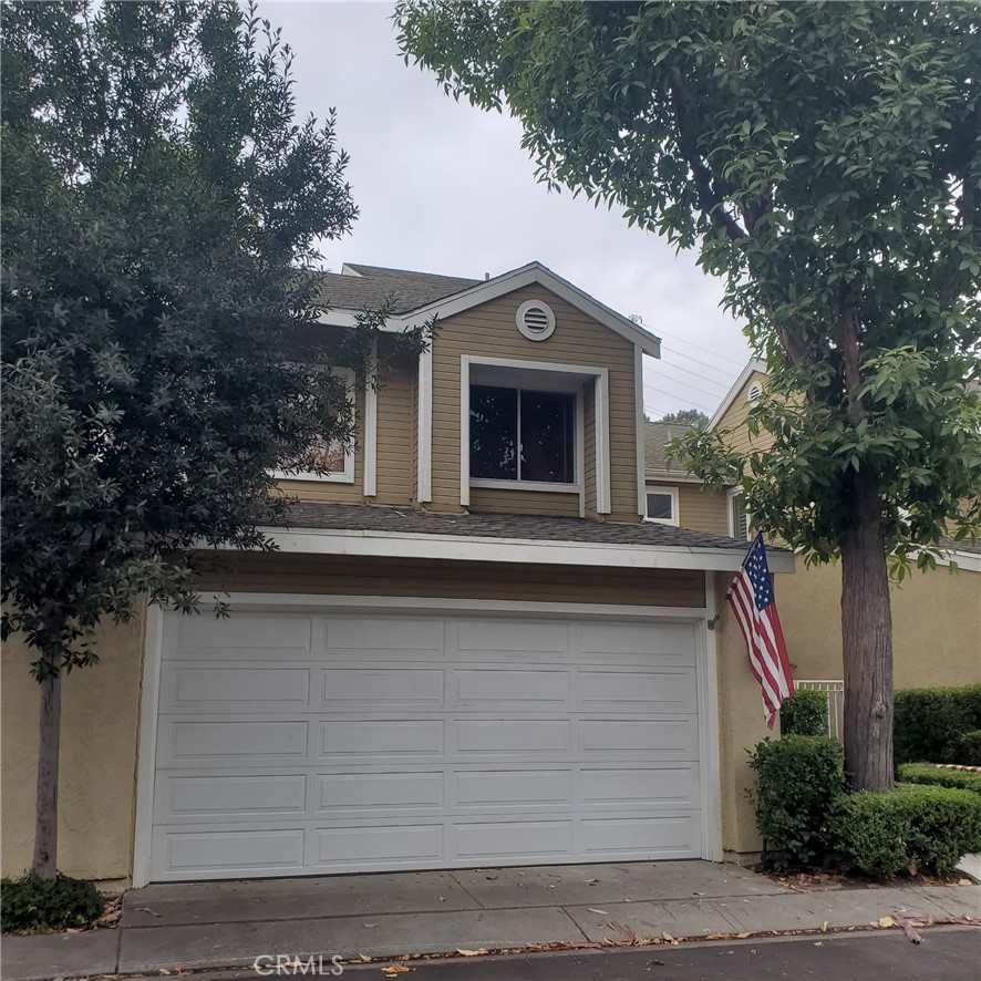 a front view of a house with yard