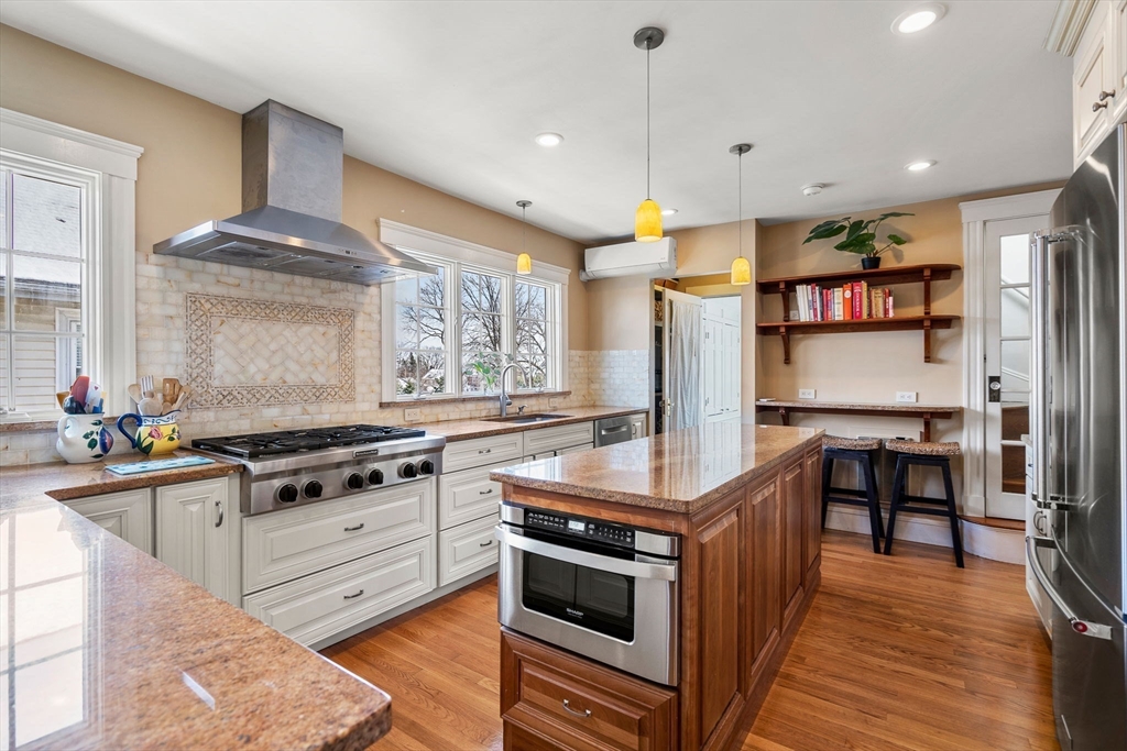 a kitchen with a stove oven and sink