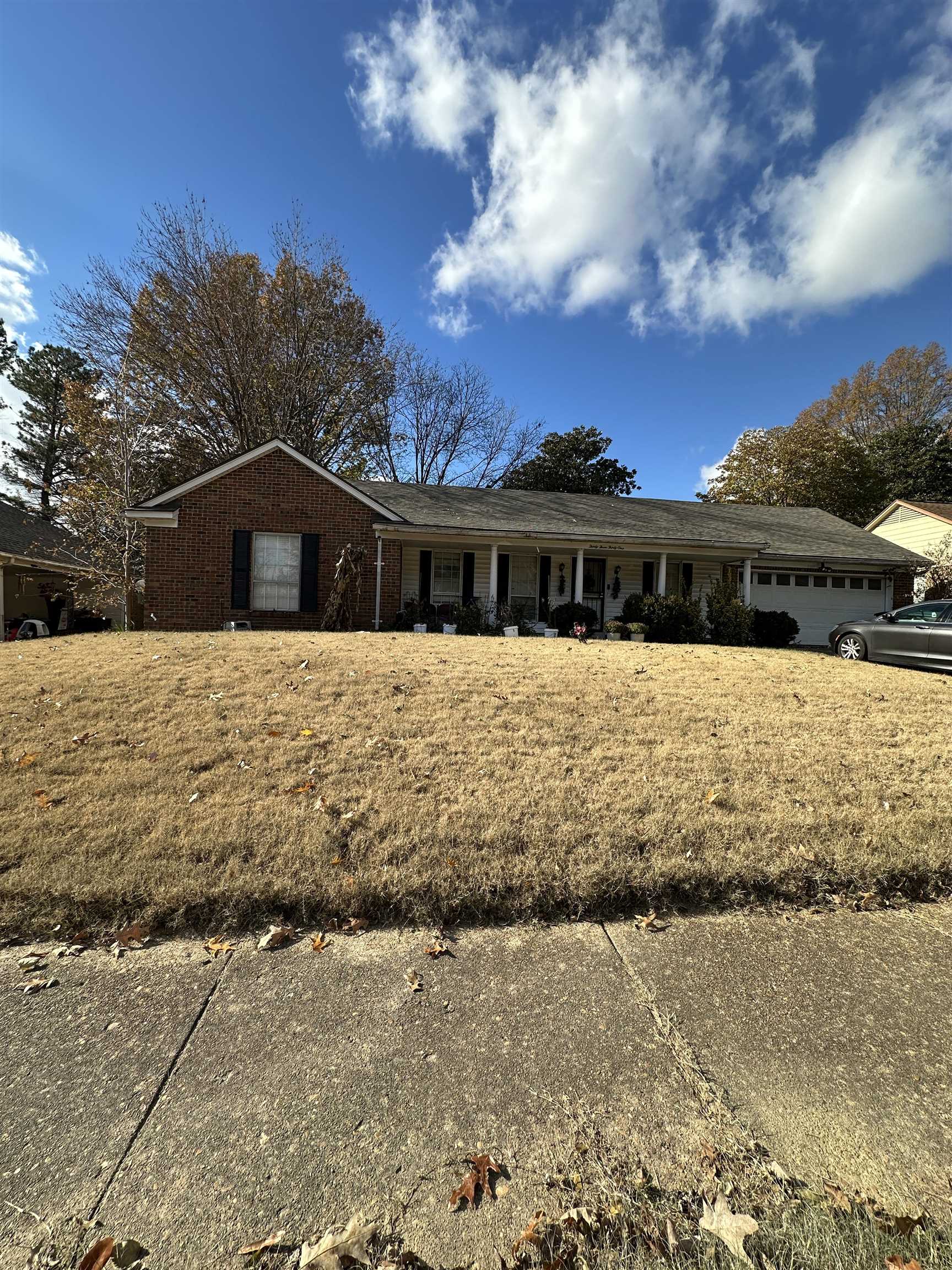 a front view of a house with a yard