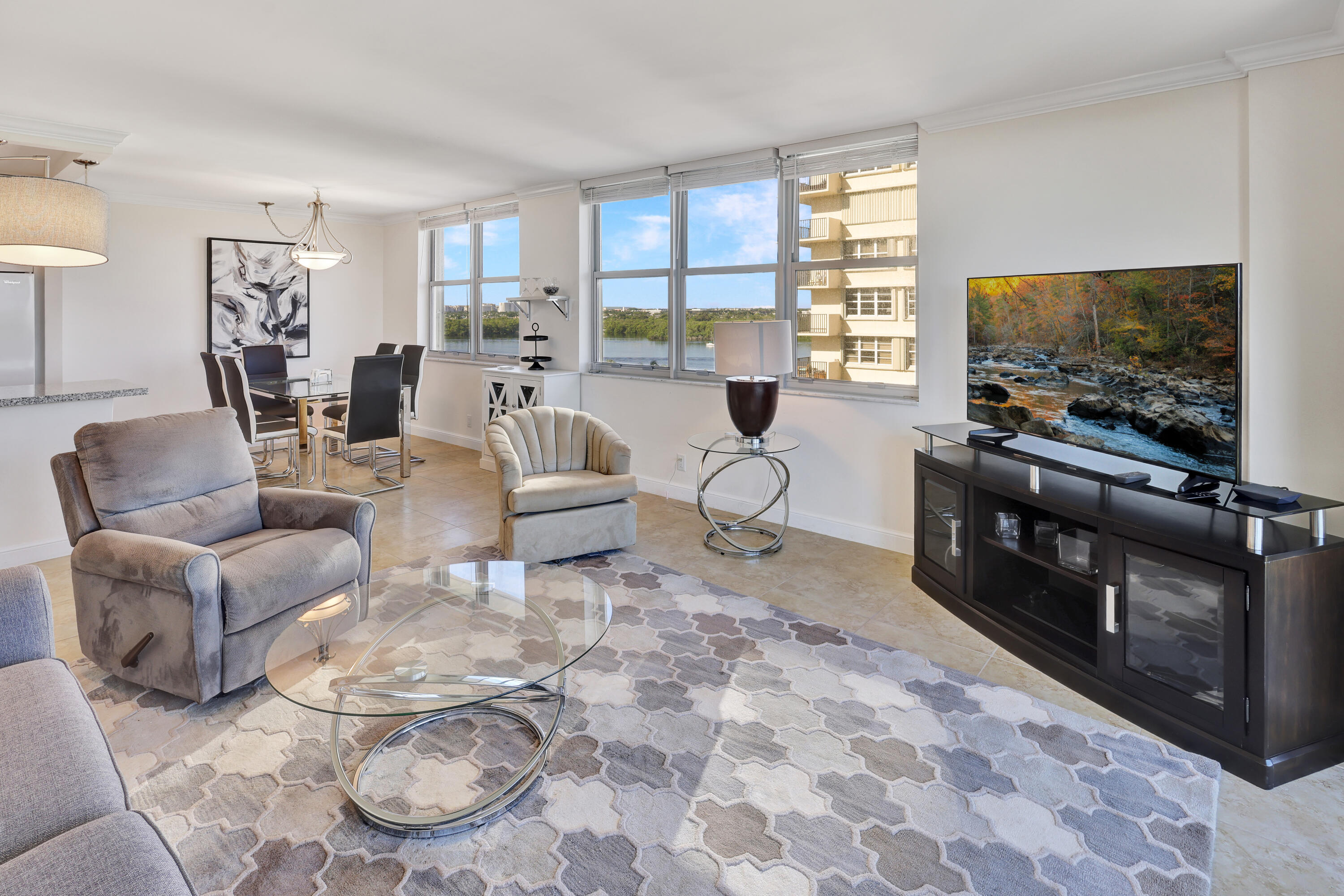 a living room with furniture and a flat screen tv