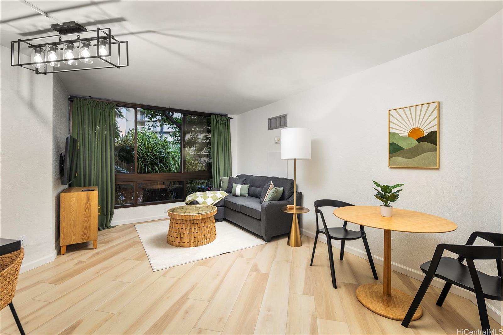 a living room with furniture and a window