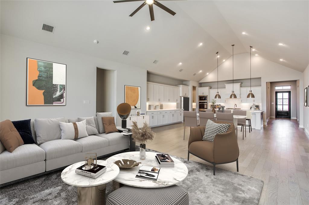 a living room with furniture and a dining table with wooden floor