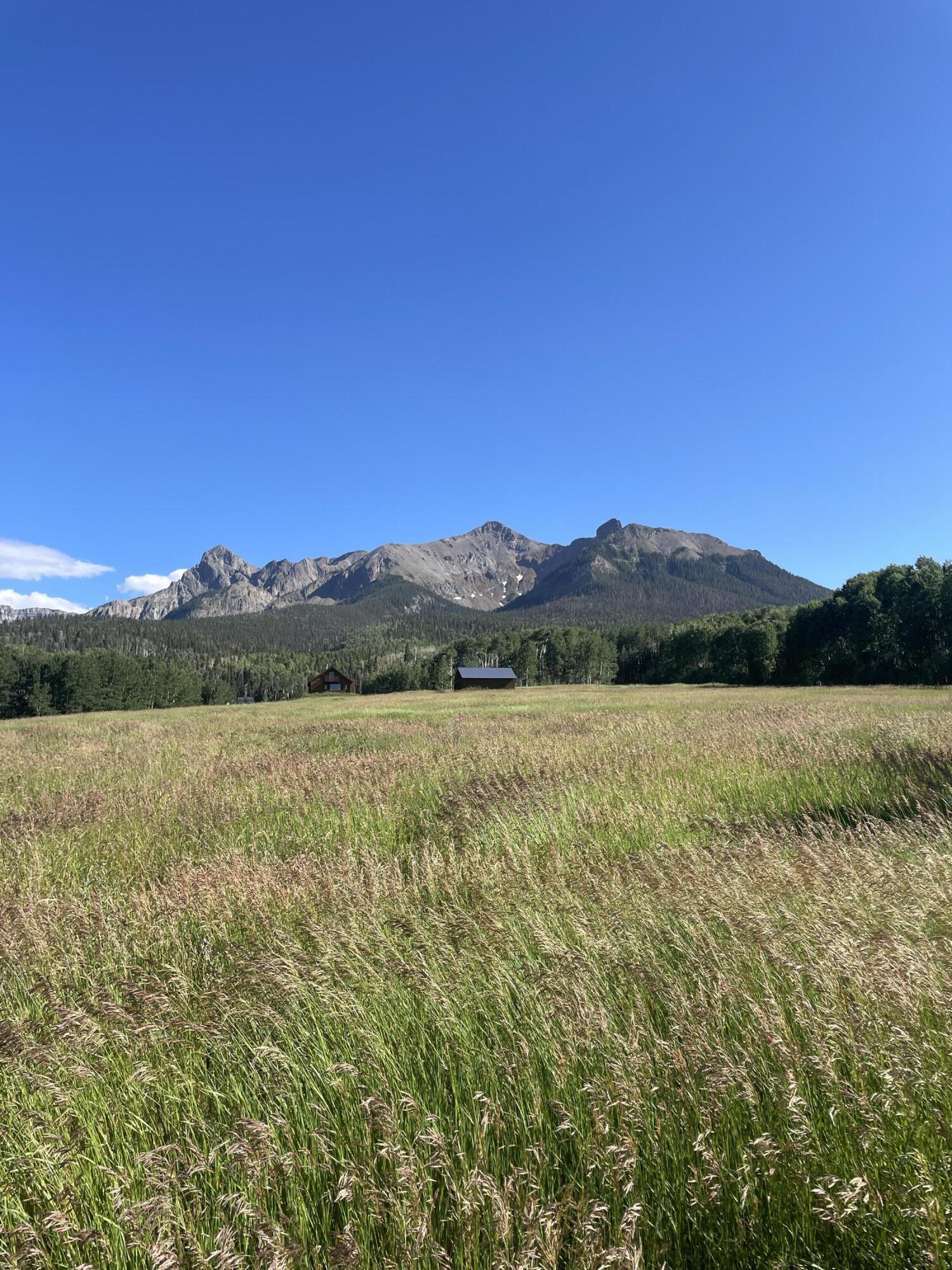 a view of lake with mountain in the background