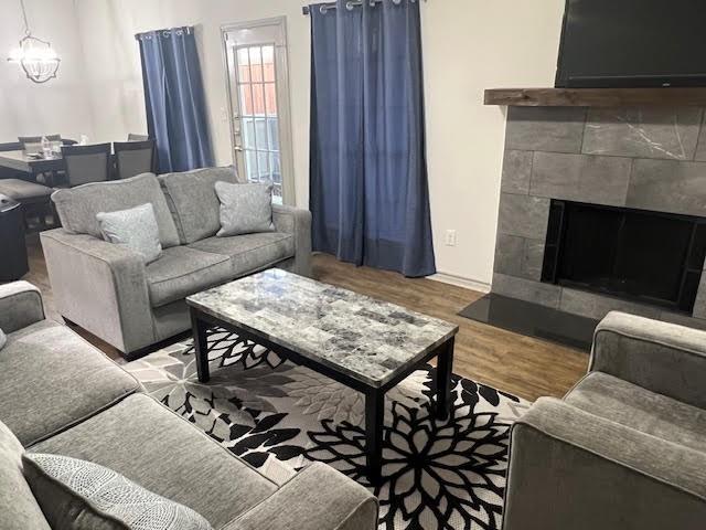 a living room with furniture and a fireplace