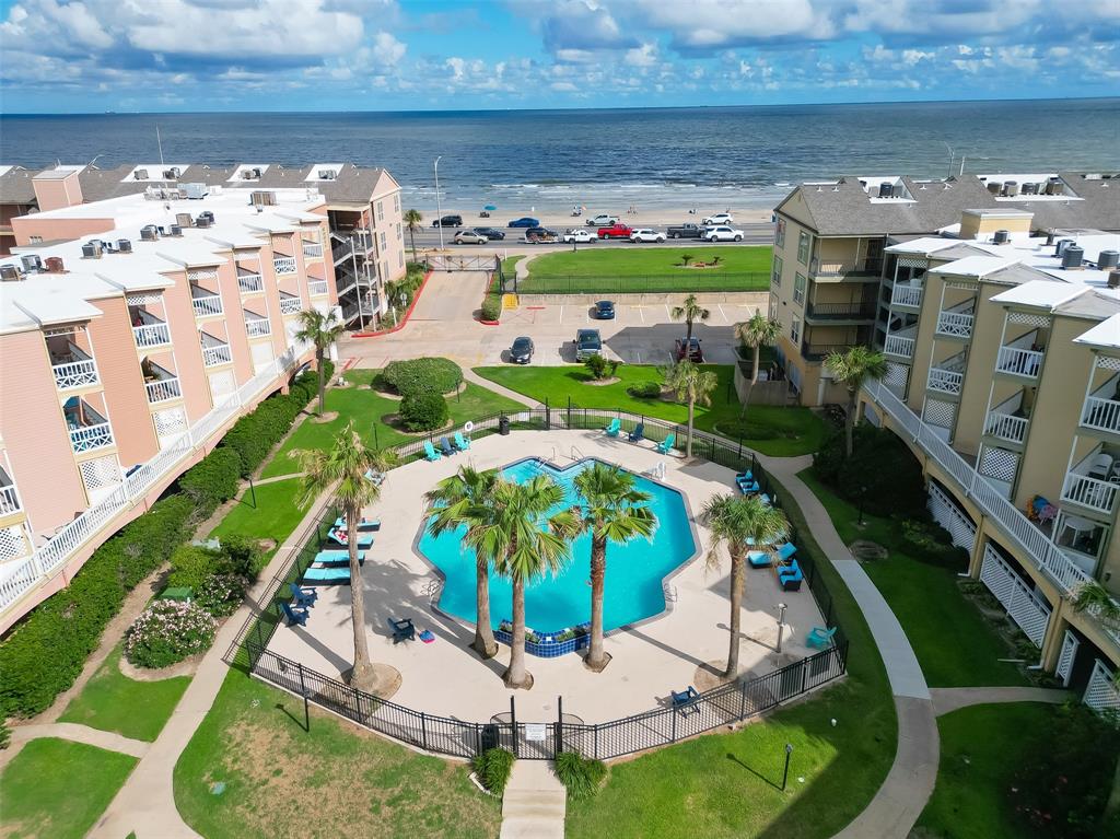 a view of swimming pool with a yard