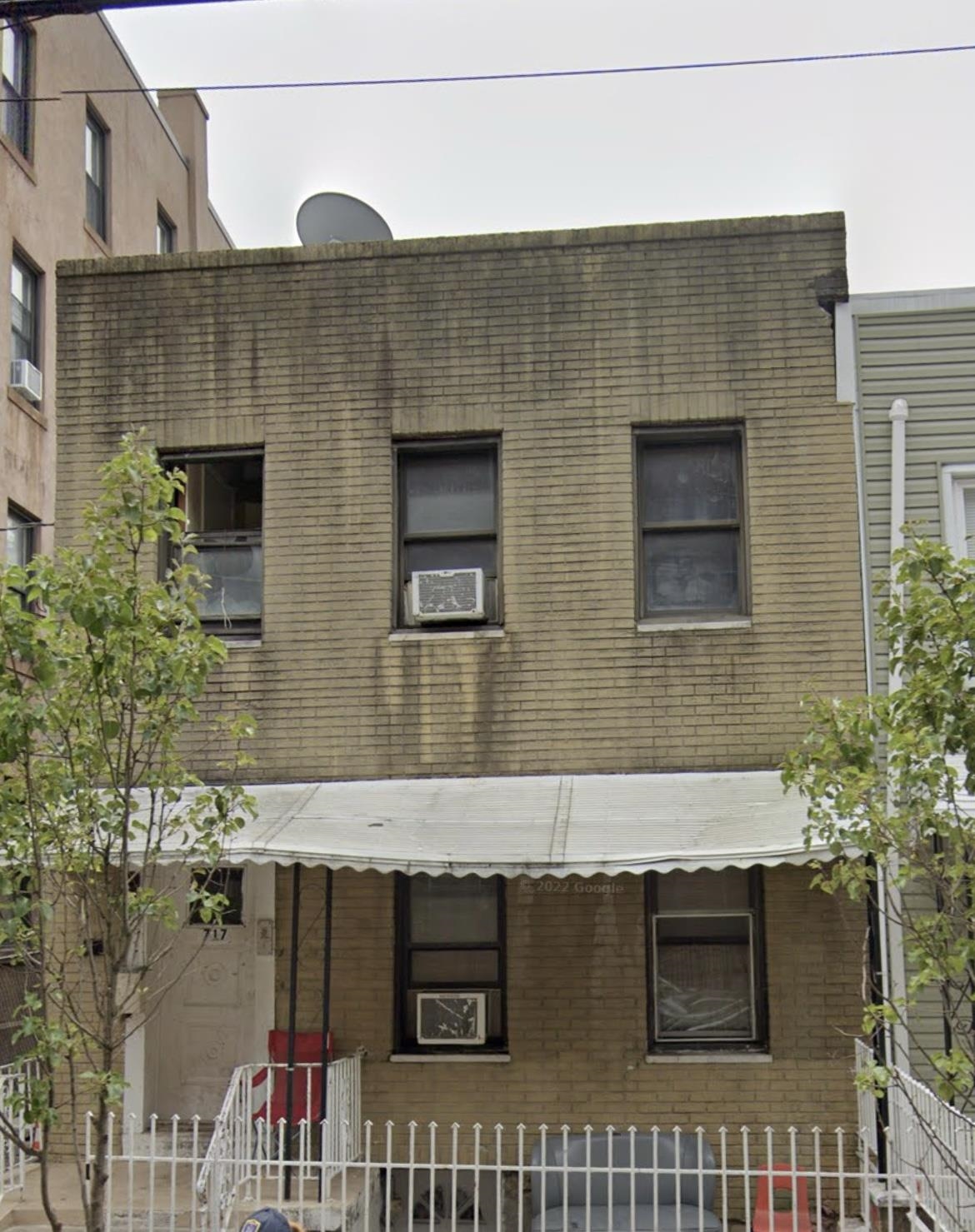 a front view of a house with a garage