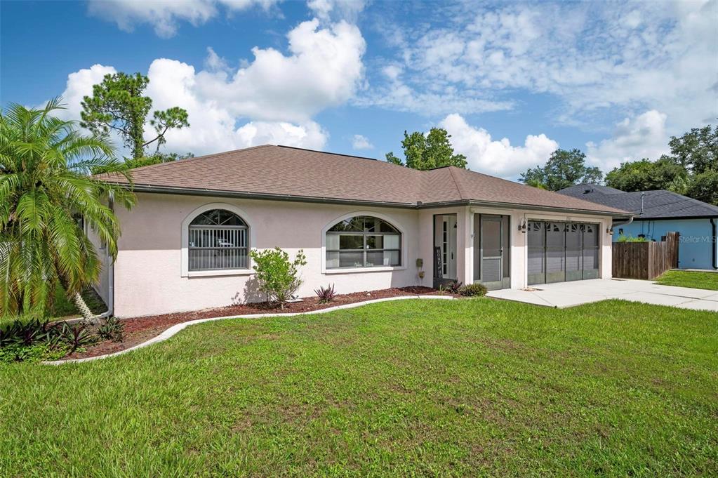 front view of a house with a yard