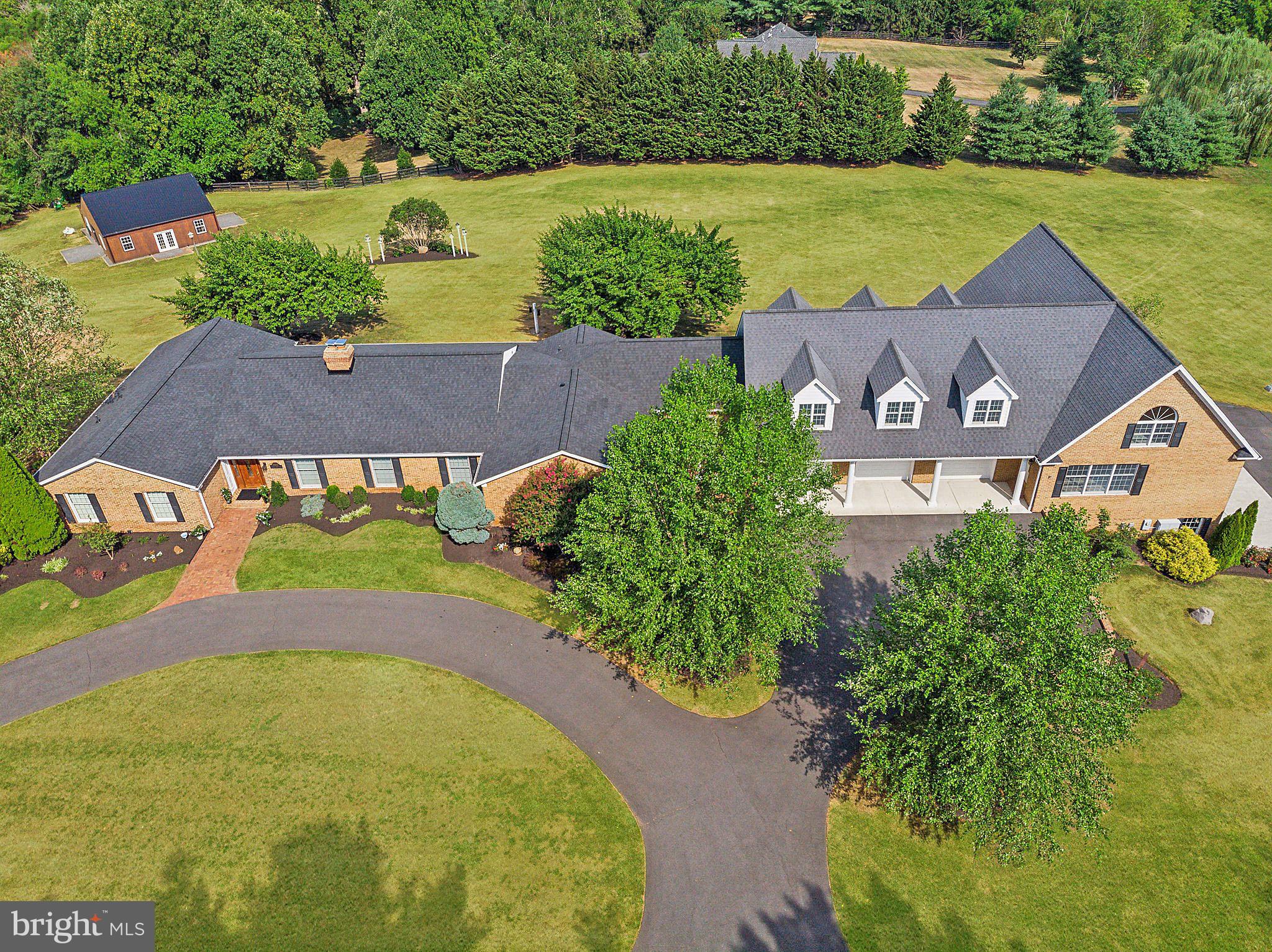 an aerial view of a house with a garden