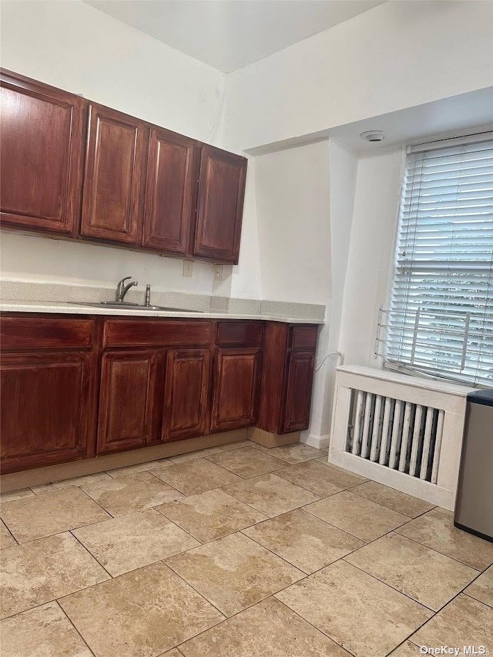 a view of kitchen with cabinets