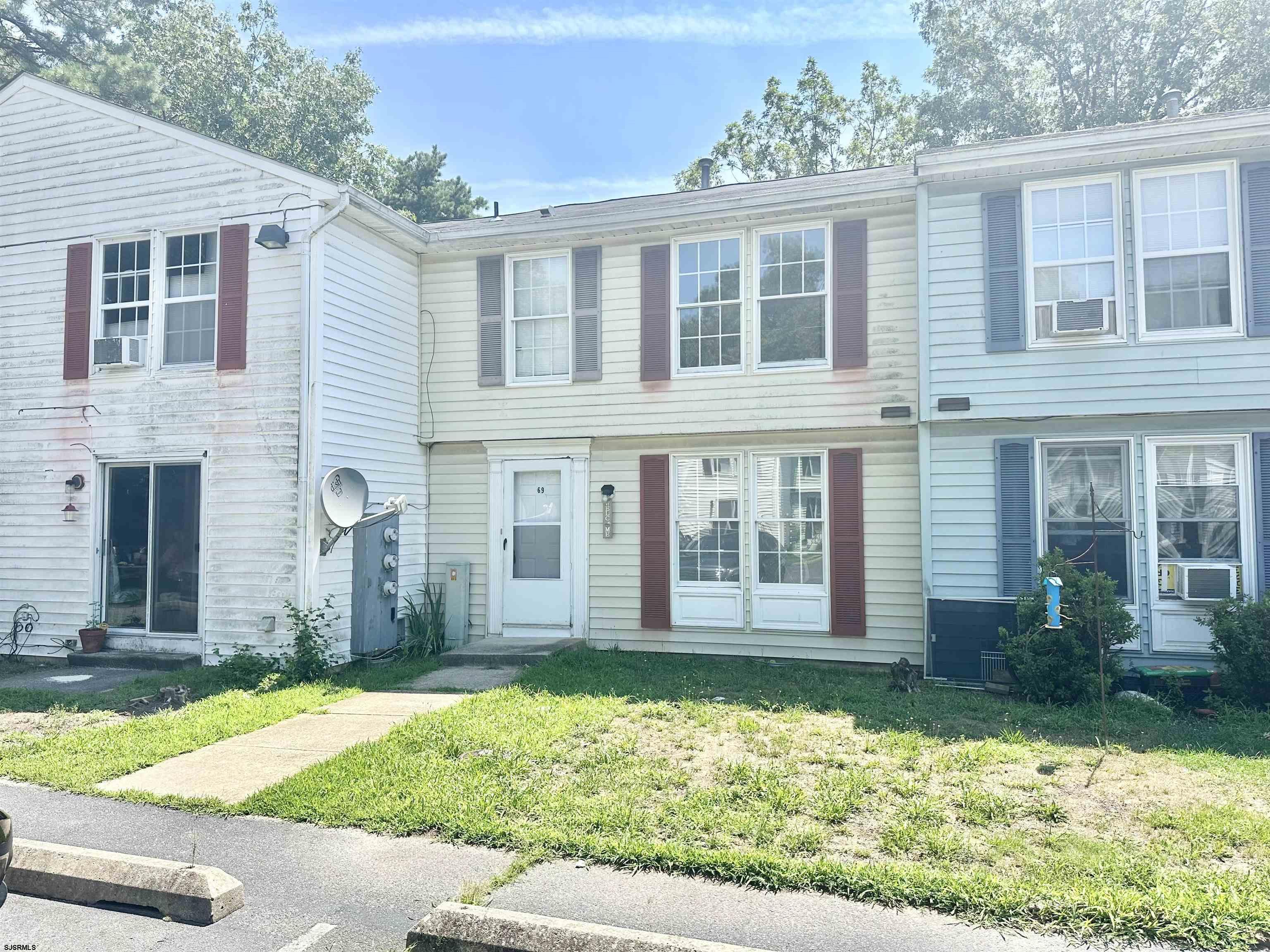 front view of a house with a yard