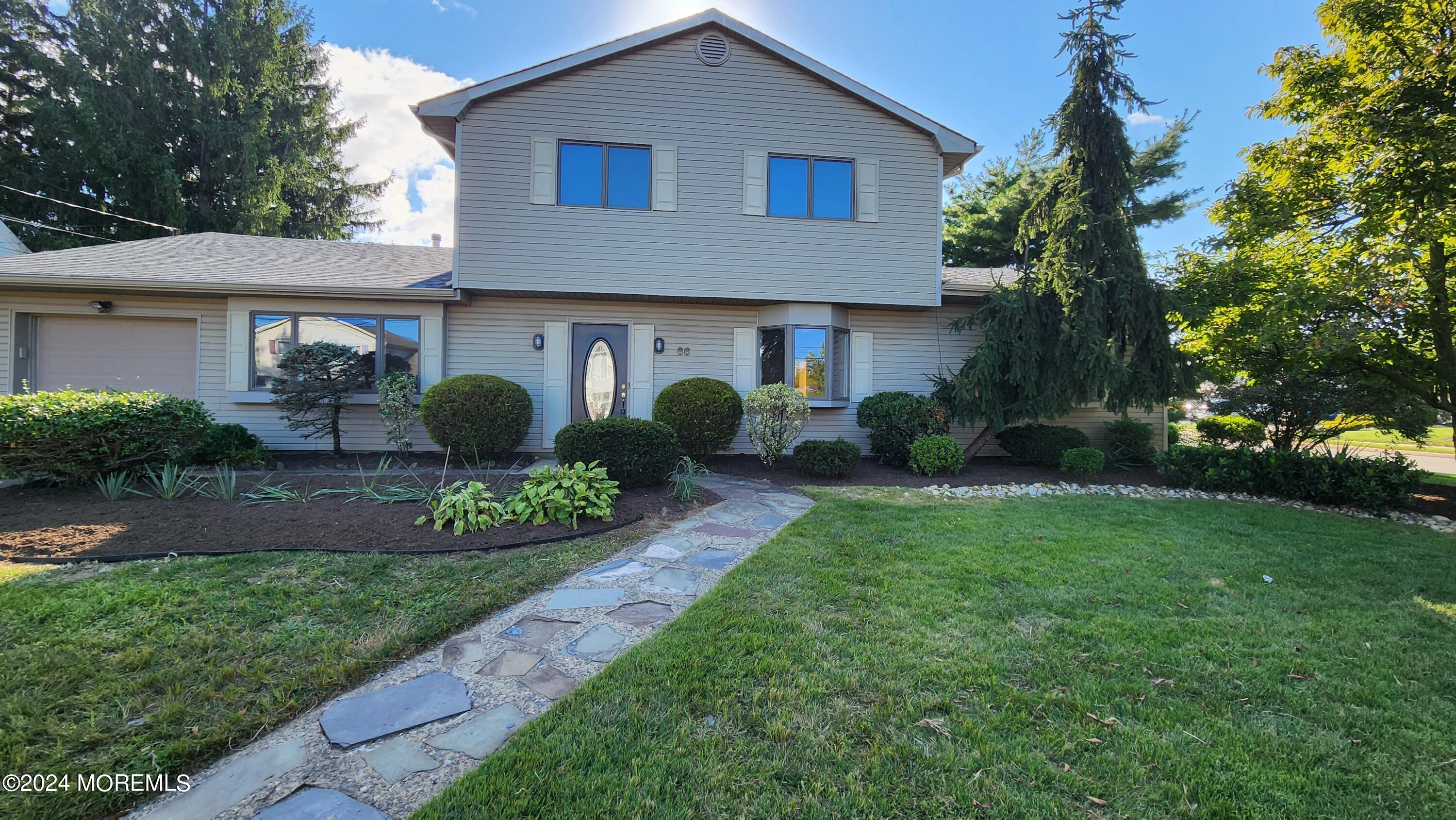 a view of a yard in front of a house