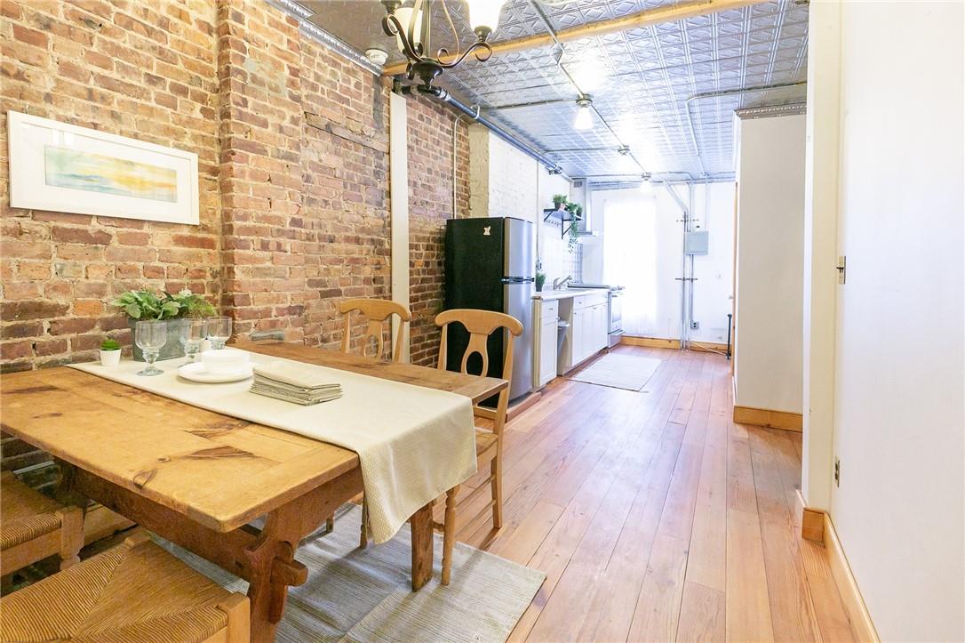 a dining room with a table and chairs