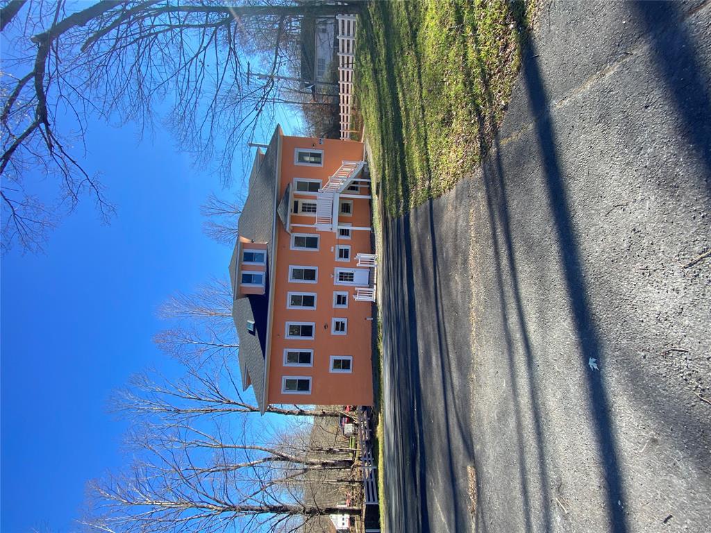 a view of a house with a big yard