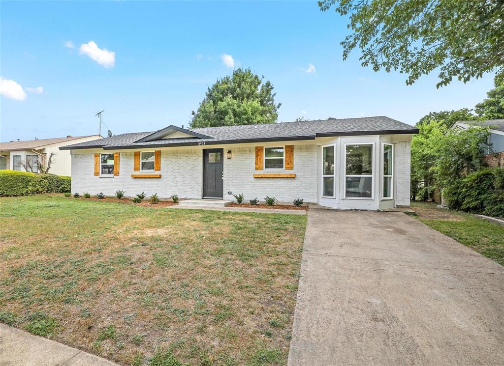 front view of a house with a yard