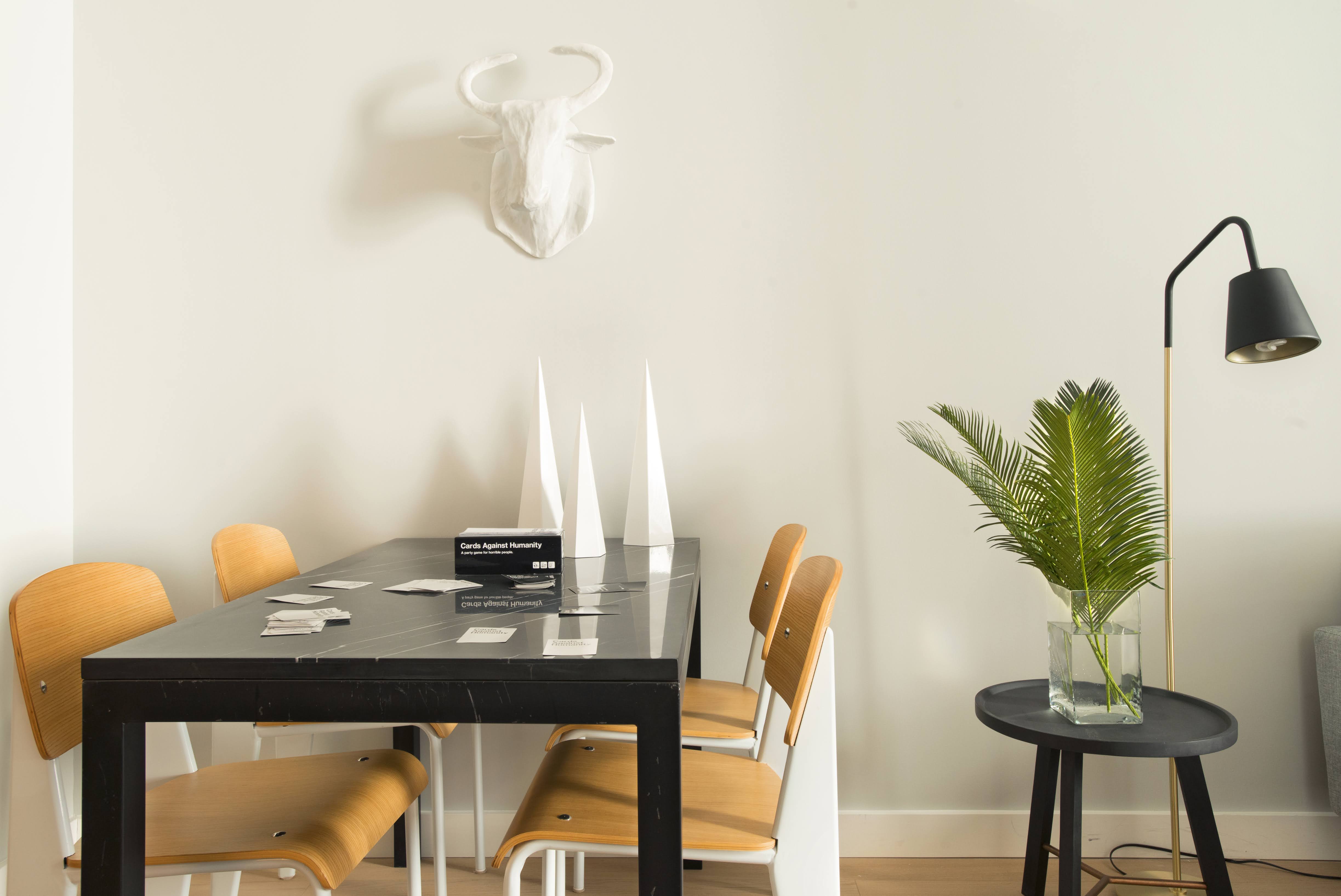 a table with a vase and flowers on it