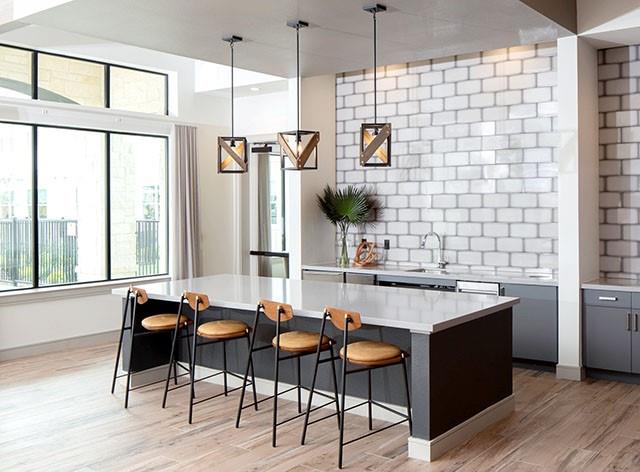 a kitchen with a sink cabinets and appliances