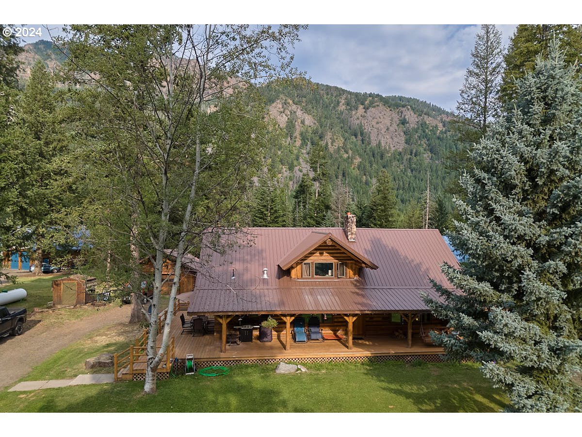 a aerial view of a house with a yard