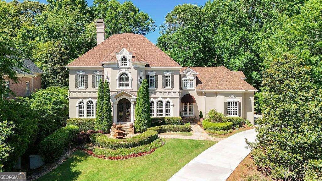 a front view of a house with yard