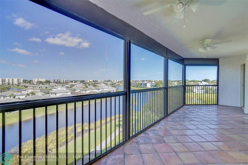 a view of a porch and a floor to ceiling window